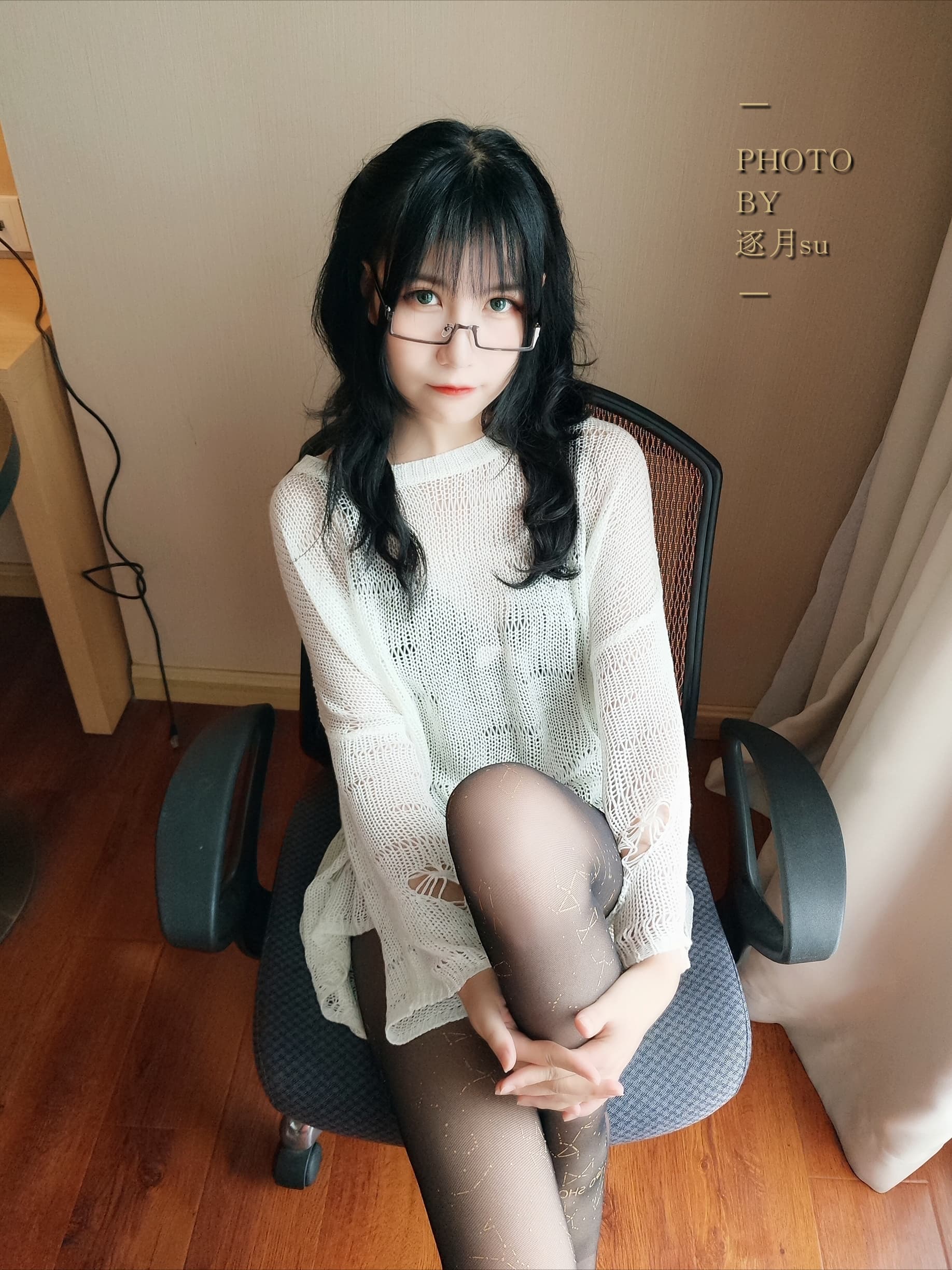 Close-up of black nylons hugging feet, showcasing glossy arches and defined toe silhouettes in low light